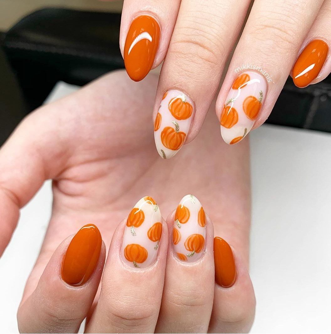 Glossy pumpkin orange almond nails