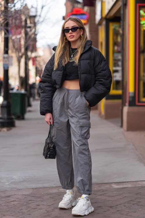 Cropped puffer with cargo pants and sneakers