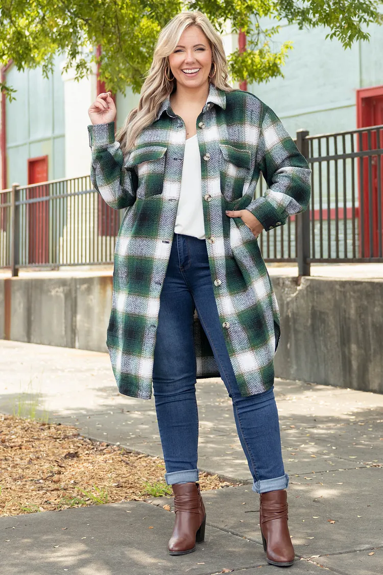 Plus size faux leather moto jacket over a sweater dress