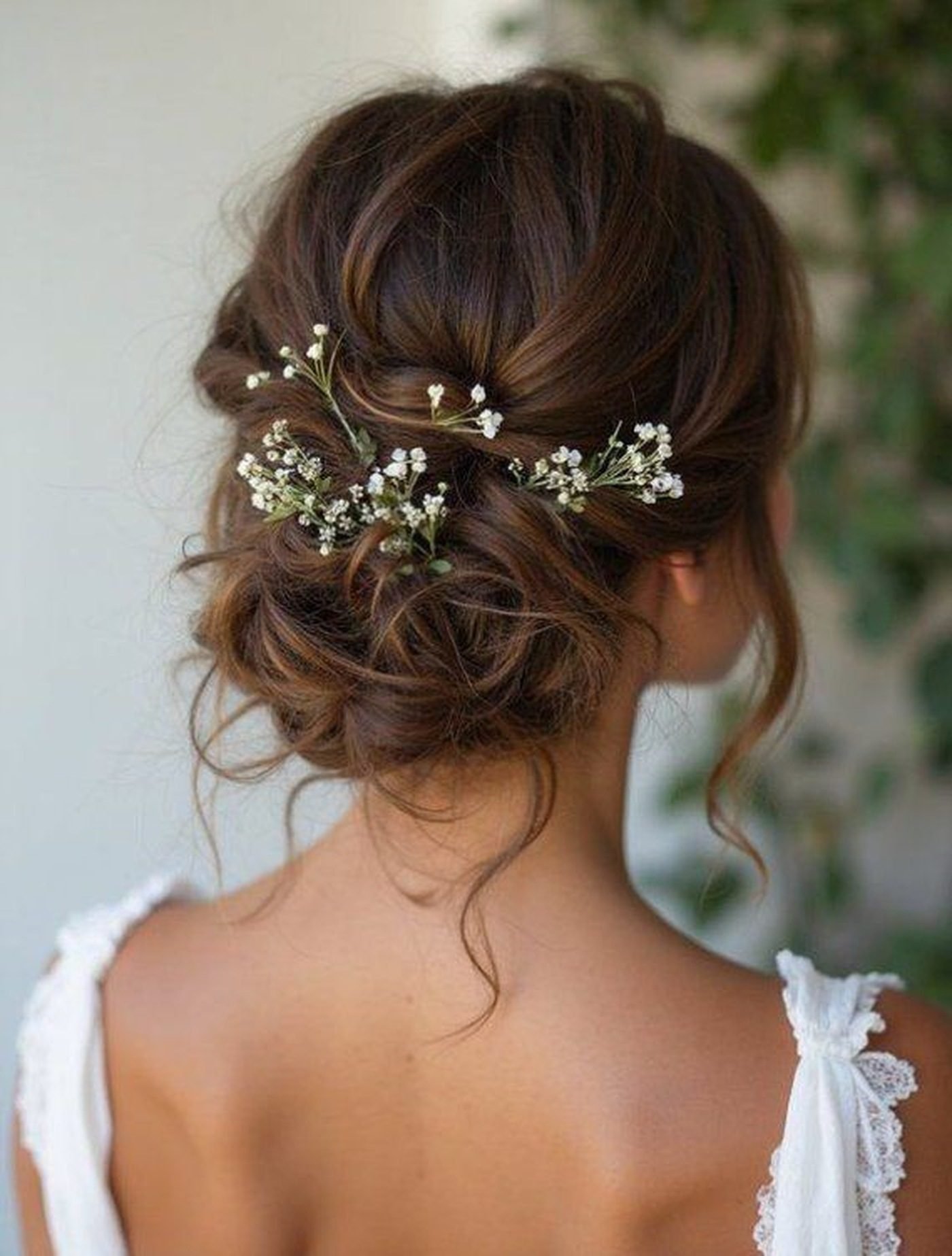 Romantic Low Bun With Floral Details