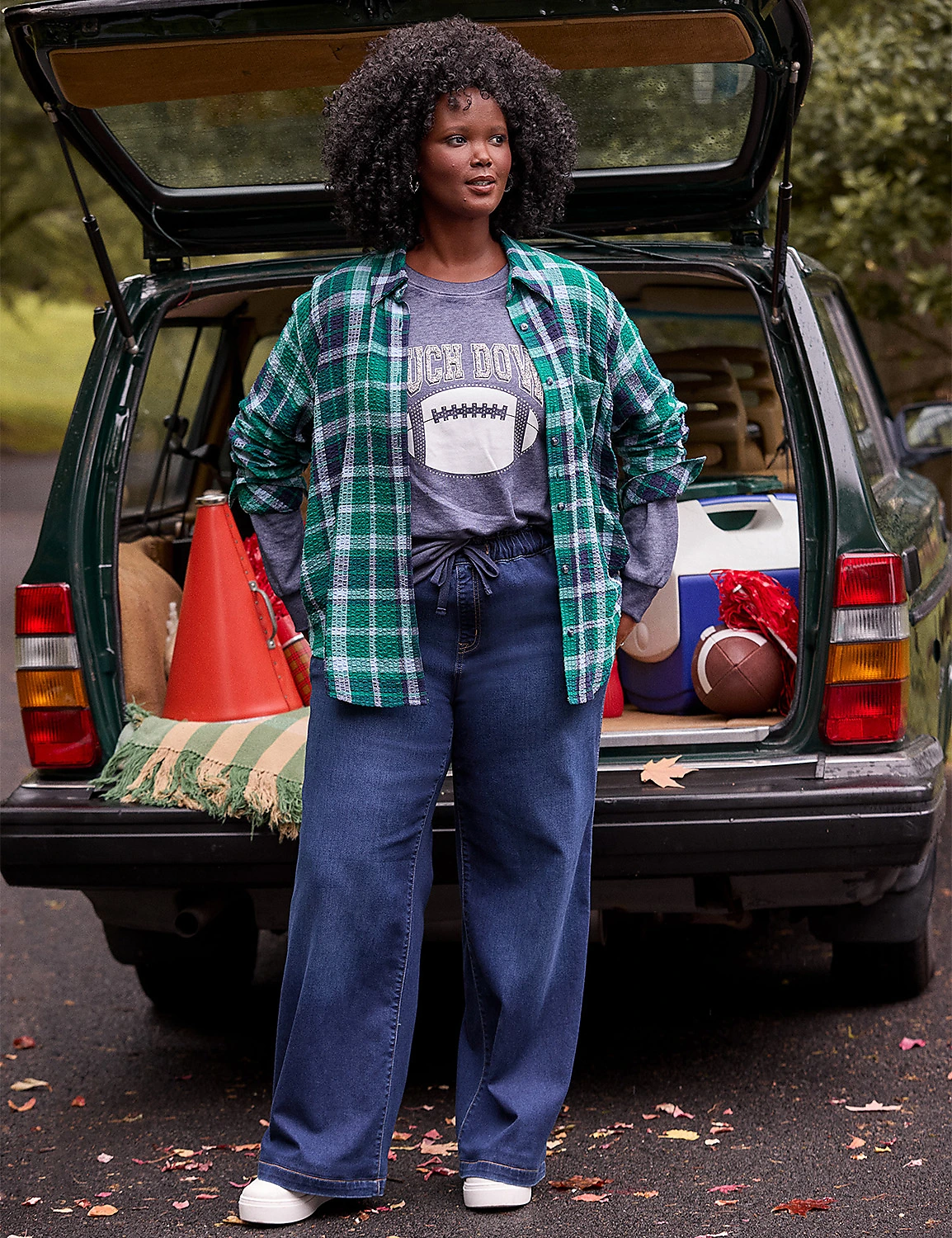 Team-color sweater with leggings for a cozy tailgate outfit