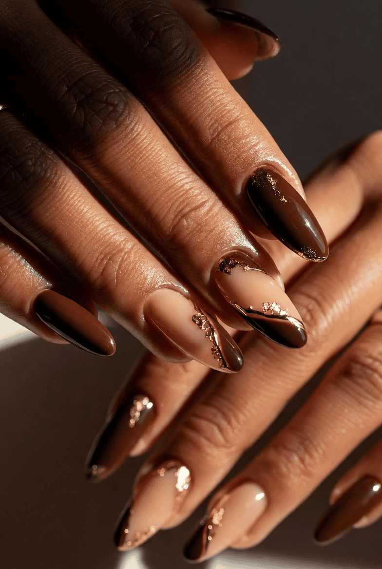Deep mahogany brown nails with gold leaf tip accents