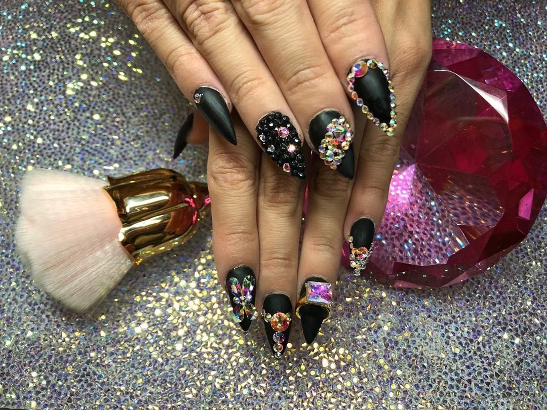 Glossy black nails with crystal rhinestone accents