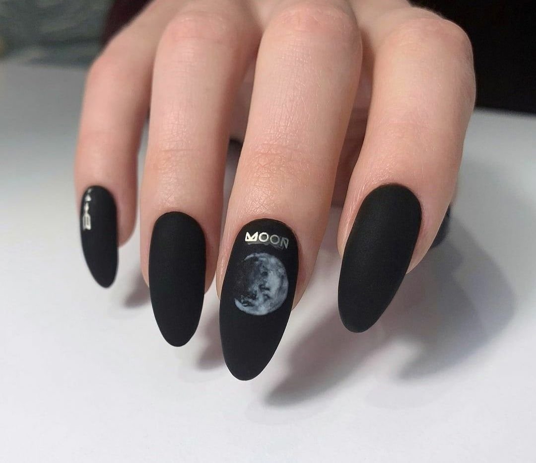 Matte black nails with holographic moon phase decals