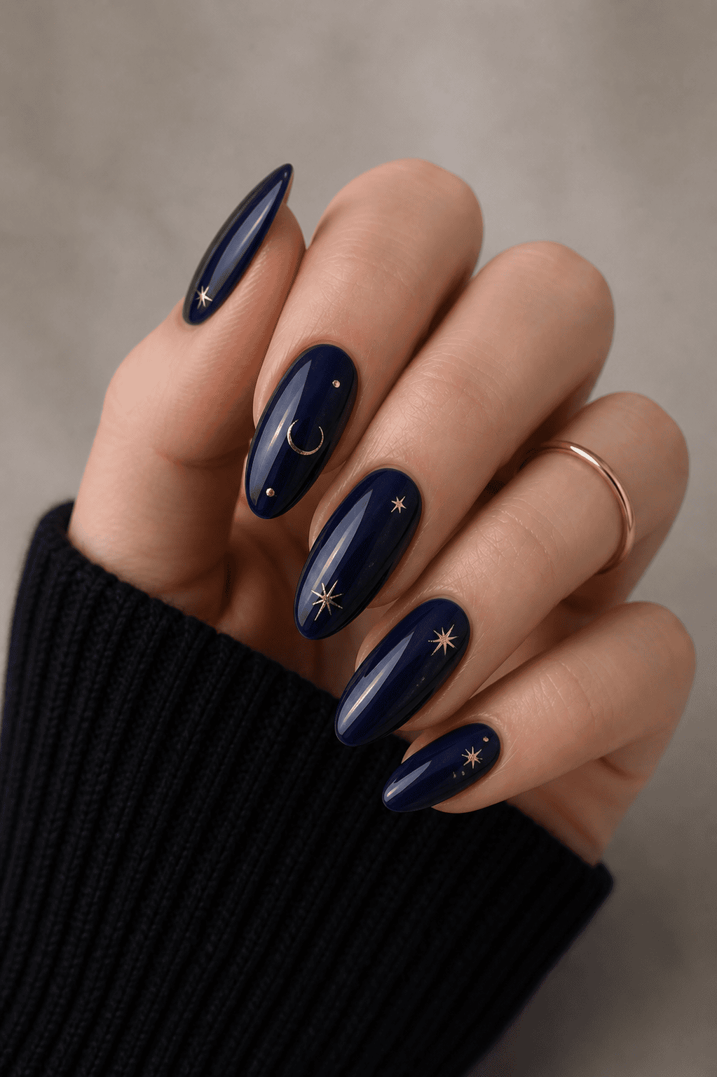 Midnight blue ombre nails with gold foil star accents