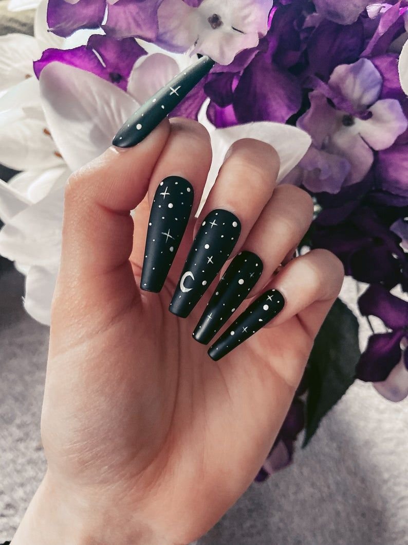 Black nails with negative space crescent moon cutout