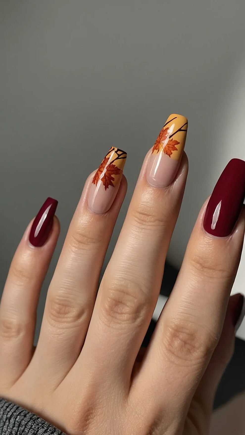 Nude nails with falling autumn leaves nail art