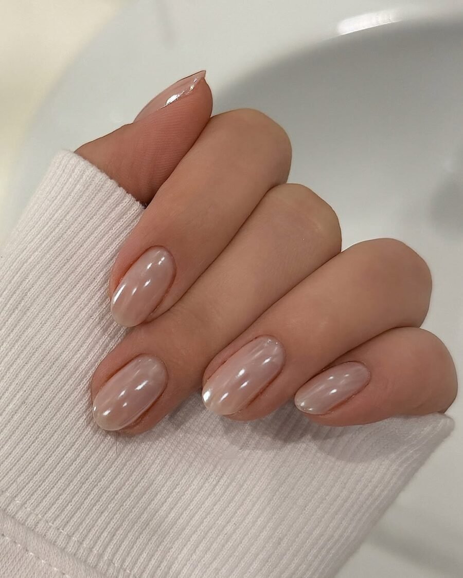 Glazed donut nails in cinnamon nude with chrome glow