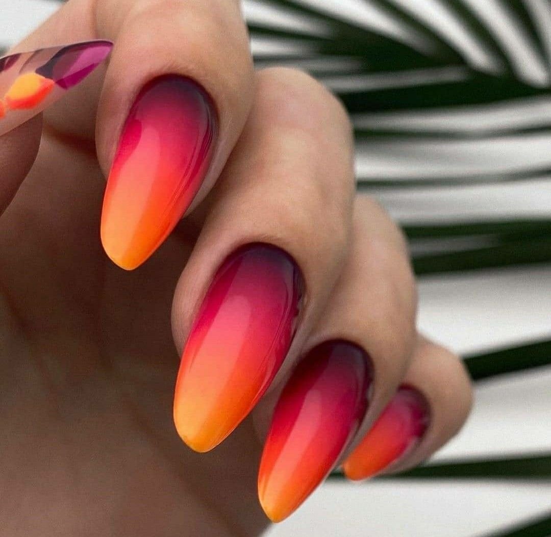 October sunset gradient nails in peach amber rose
