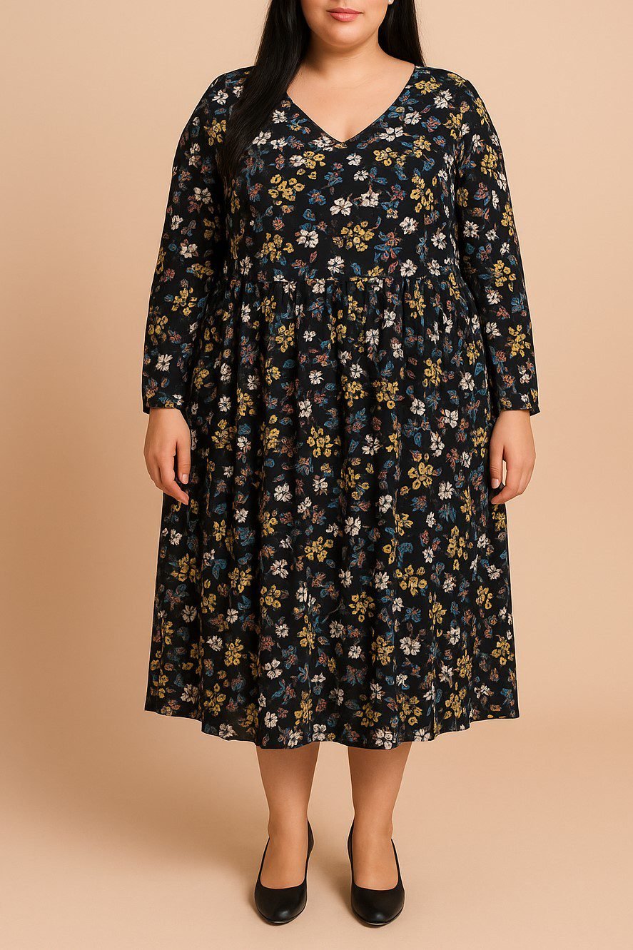 Plus size woman wearing a moody floral midi dress for autumn