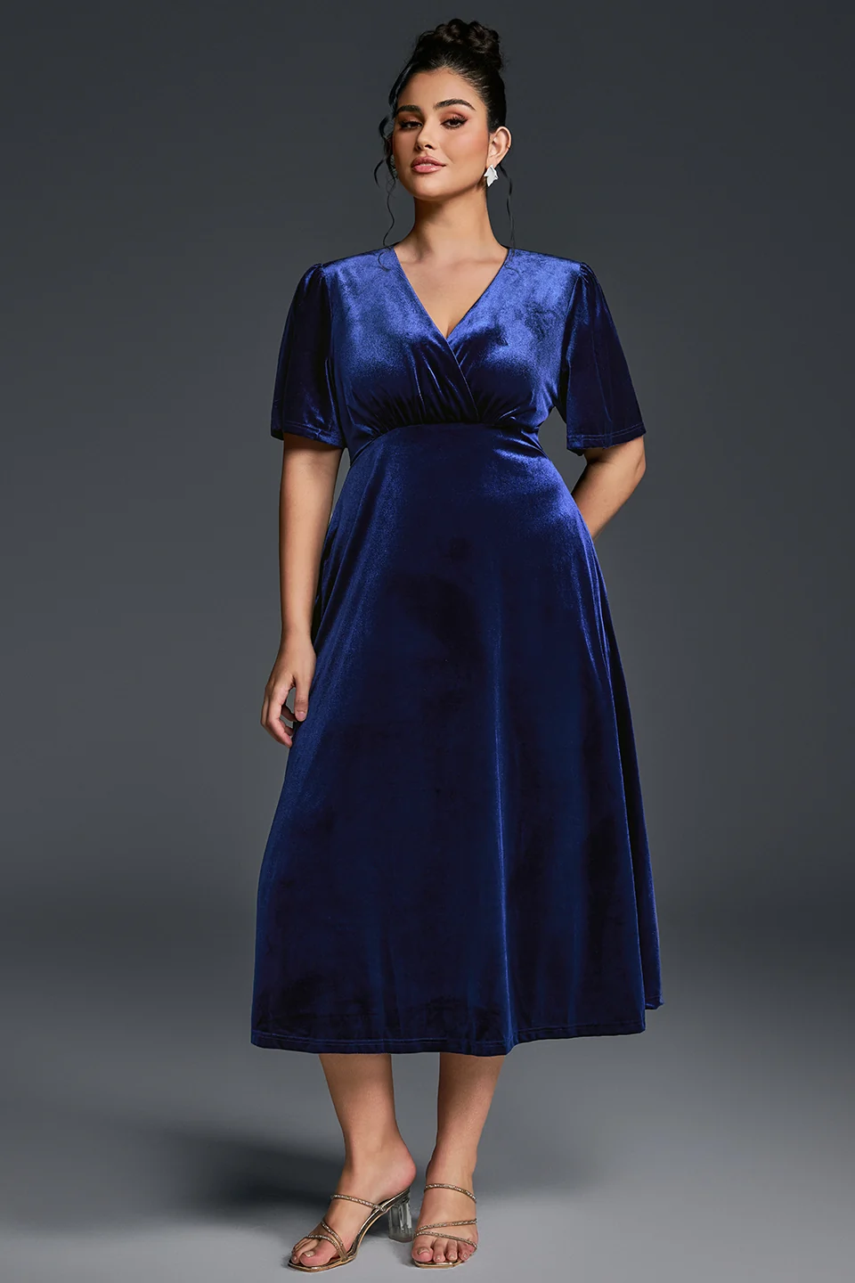 Plus size woman in a velvet fit-and-flare dress