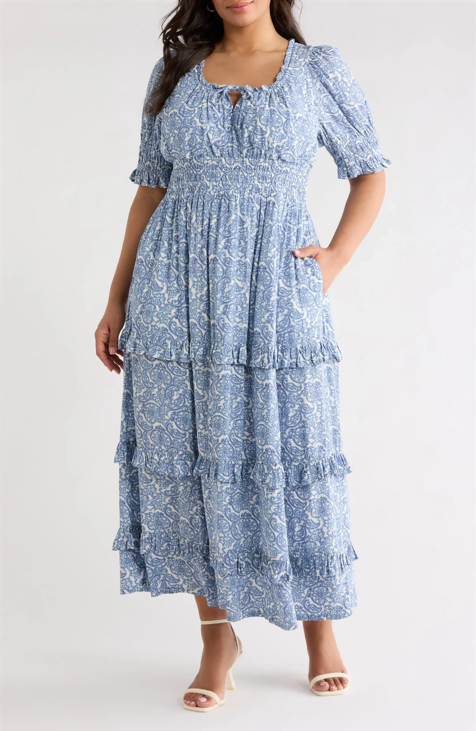 Plus size woman in a smocked-bodice maxi dress for fall