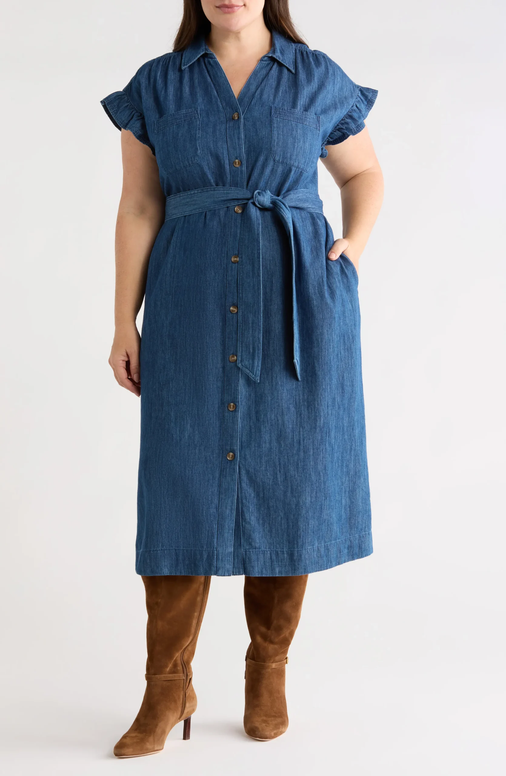Plus size woman in a denim midi dress for fall
