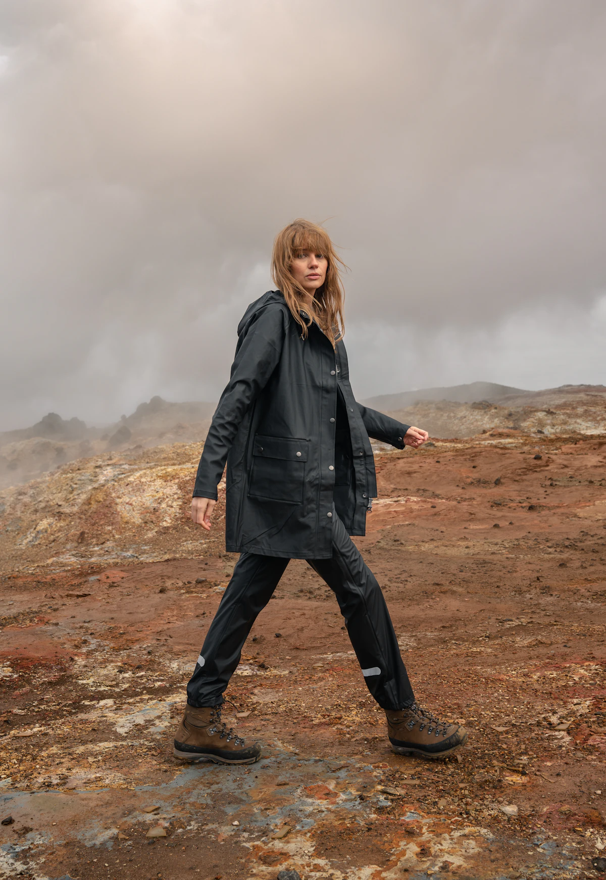 Woman wearing a waterproof parka with joggers