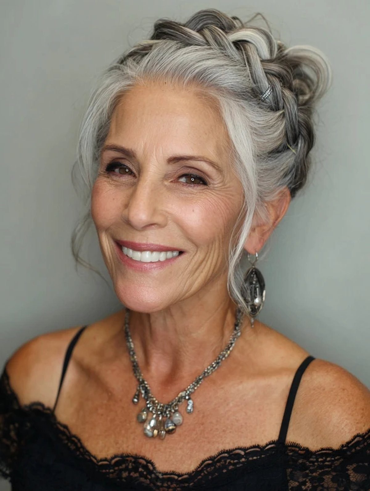 Loose braided crown updo on an older woman with fine hair
