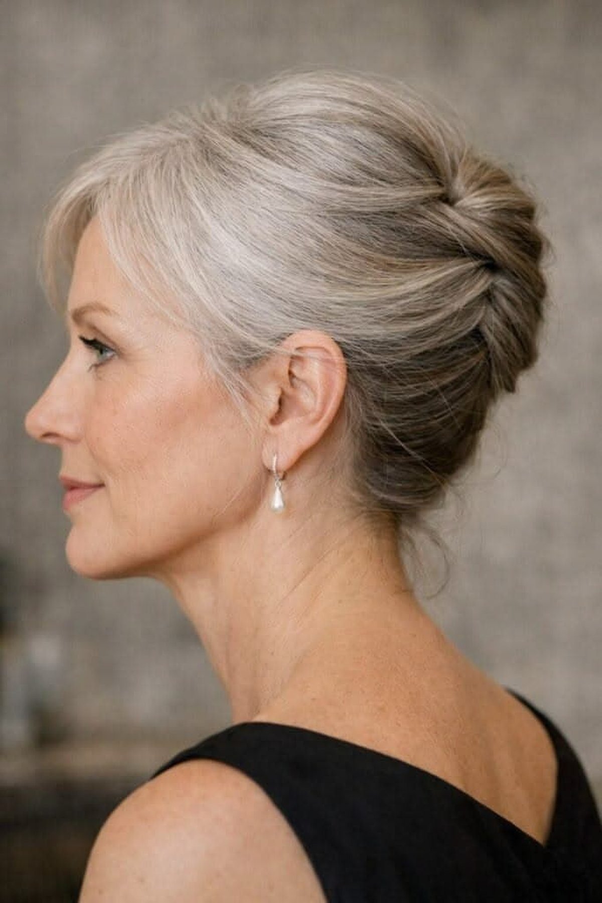 Elegant wrapped ponytail updo on a mature woman with fine hair