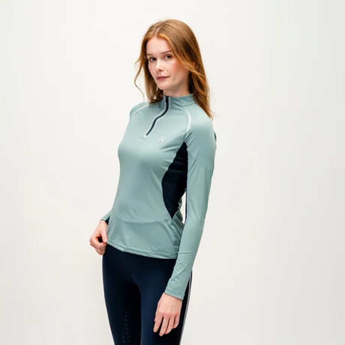 Woman in compression base layers running on a frosty day