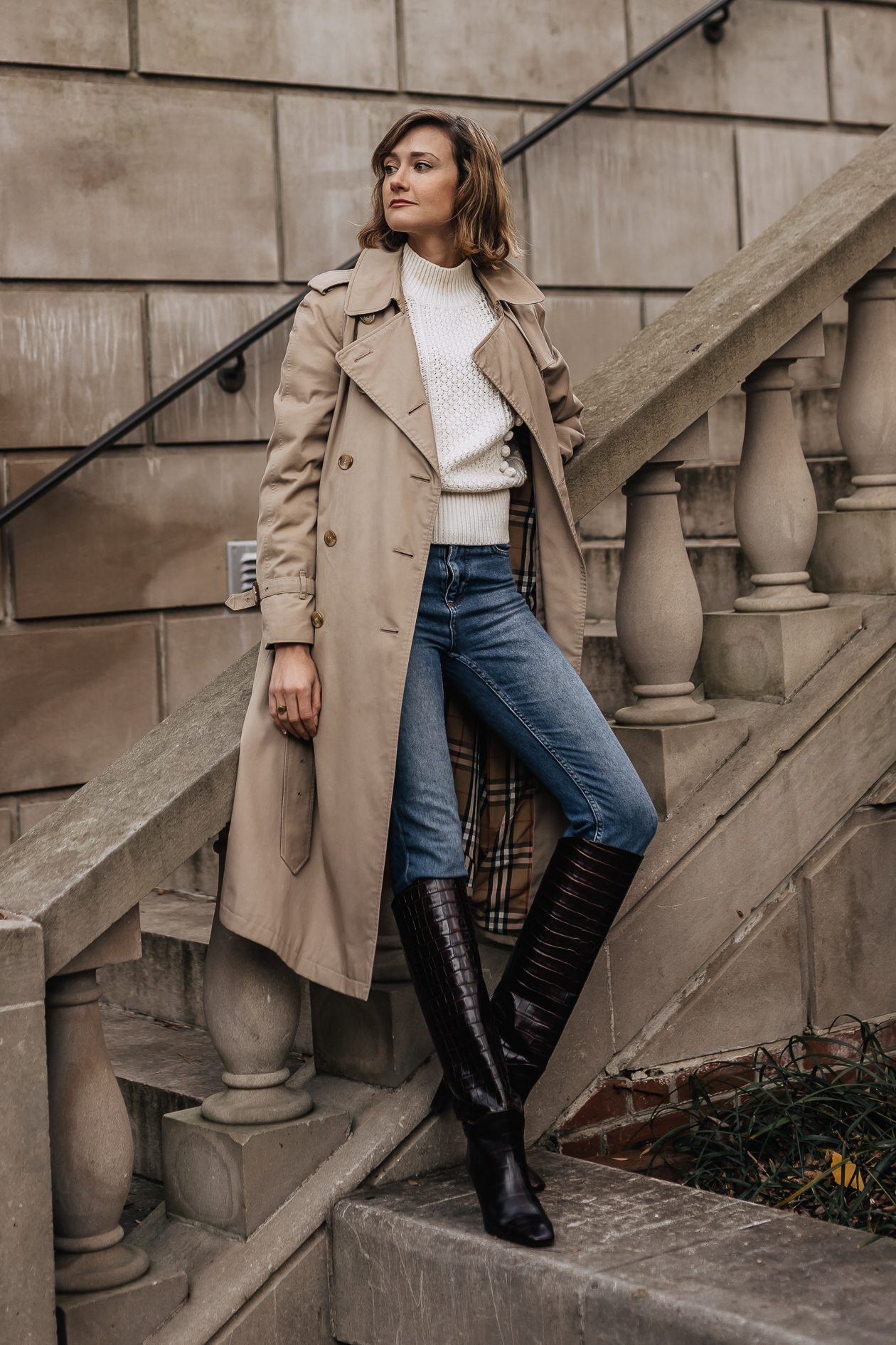 Dark jeans with classic trench coat and tall boots