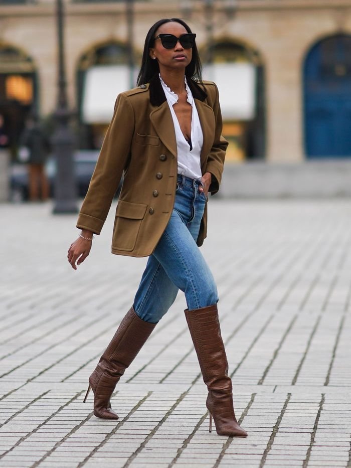 Skinny jeans tucked into wide calf boots