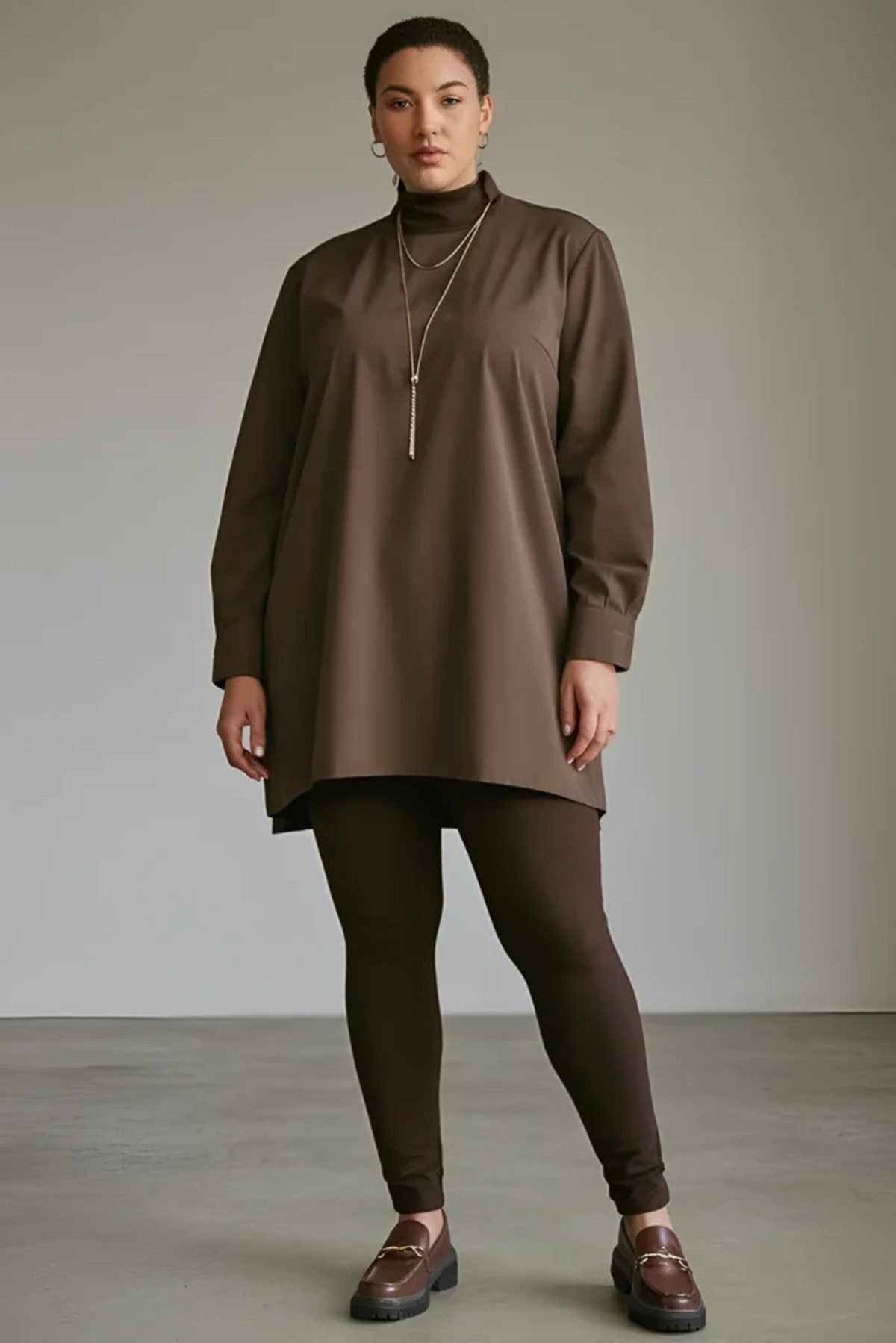 Plus size oversized hoodie with leggings and chunky sneakers for cozy fall style