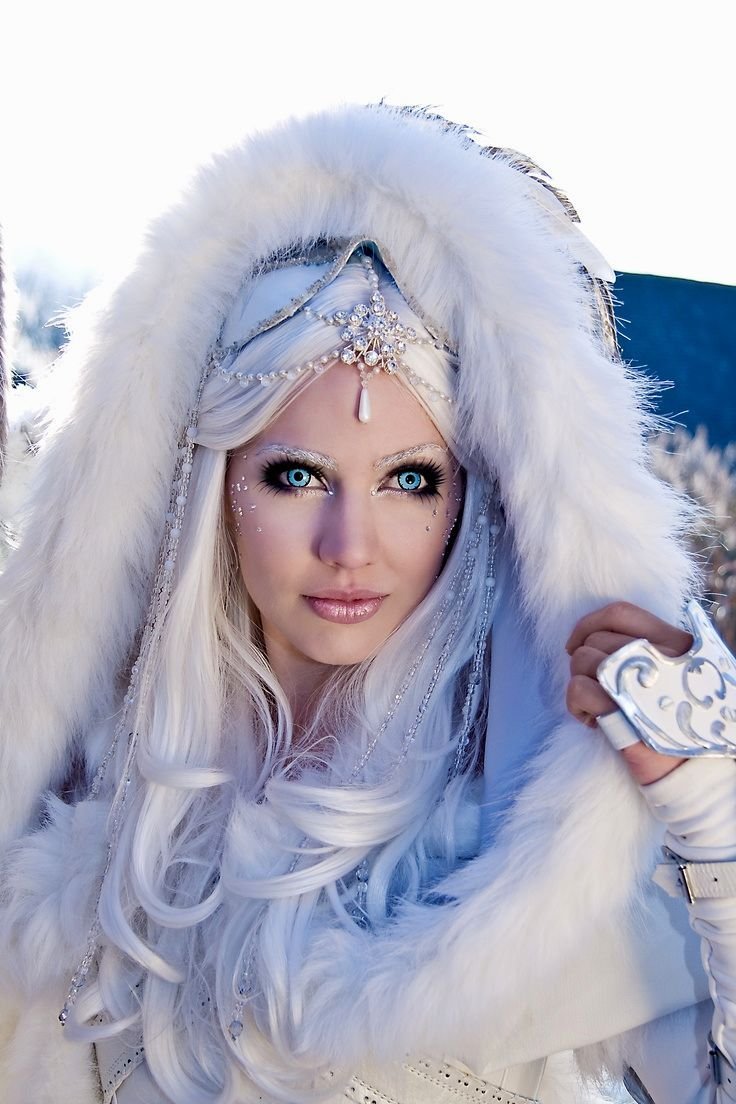Woman in a winter witch Halloween costume with white fur