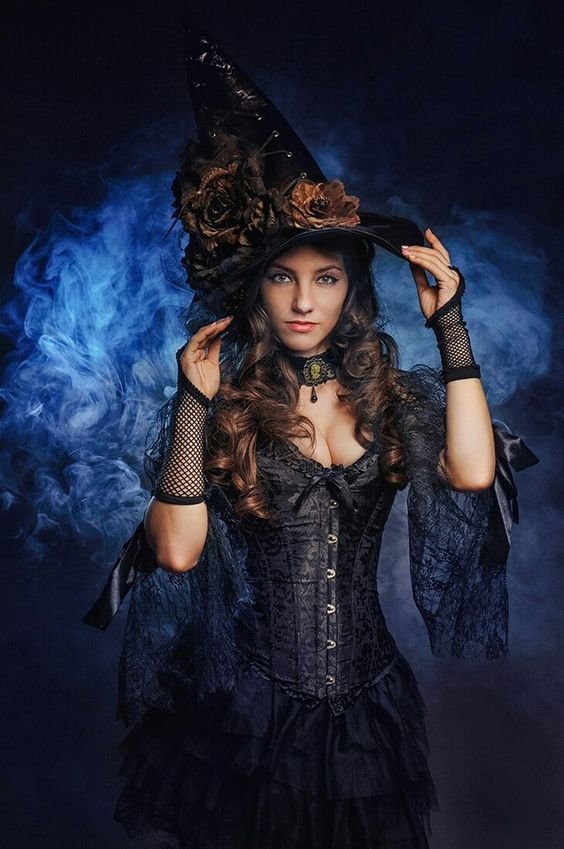 Woman in a gothic Victorian witch Halloween costume