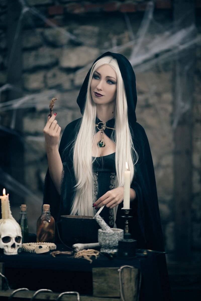Woman in a dark sorceress Halloween costume