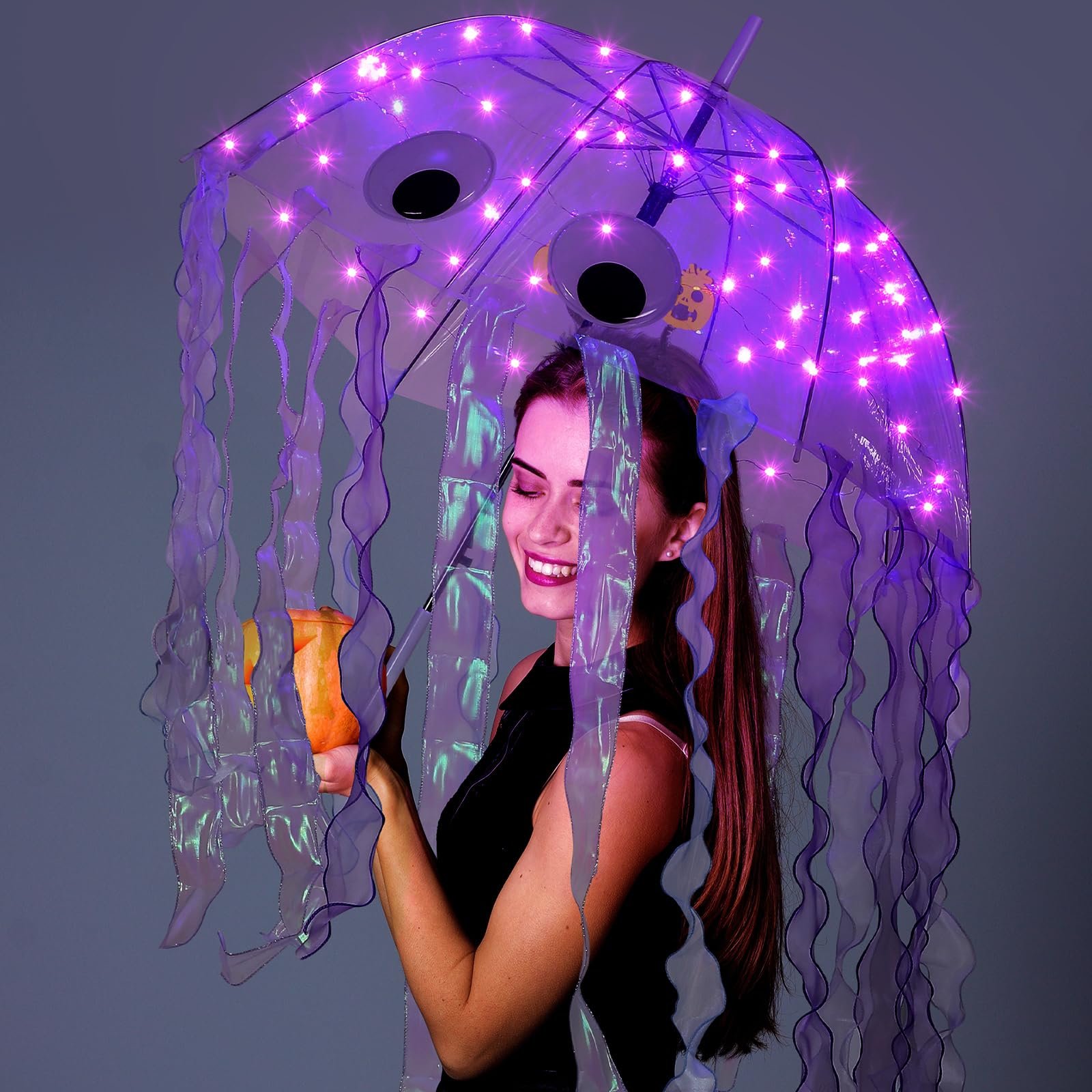 Woman in a jellyfish Halloween costume with umbrella